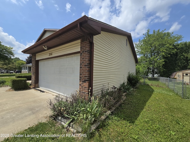 3116 Colchester Rd, Lansing, MI 48906 - view of property exterior with brick siding and driveway