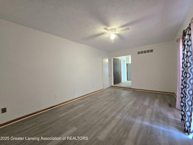 3116 Colchester Rd, Lansing, MI 48906 - unfurnished room featuring a ceiling fan and wood finished floors