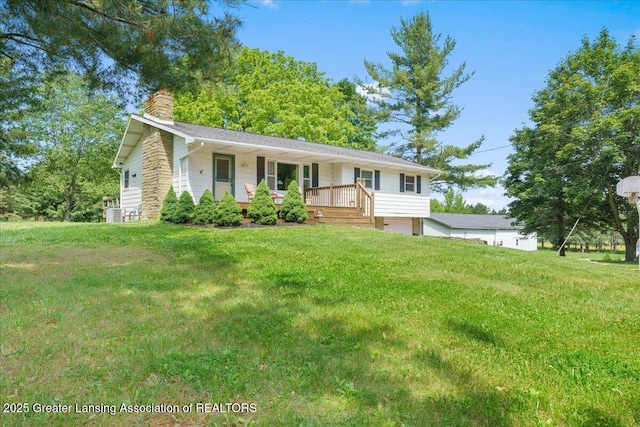 1754 S College Rd, Mason, MI 48854 - single story home featuring a chimney, a porch, and a front lawn