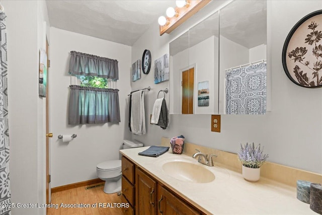 1754 S College Rd, Mason, MI 48854 - bathroom featuring vanity and wood finished floors