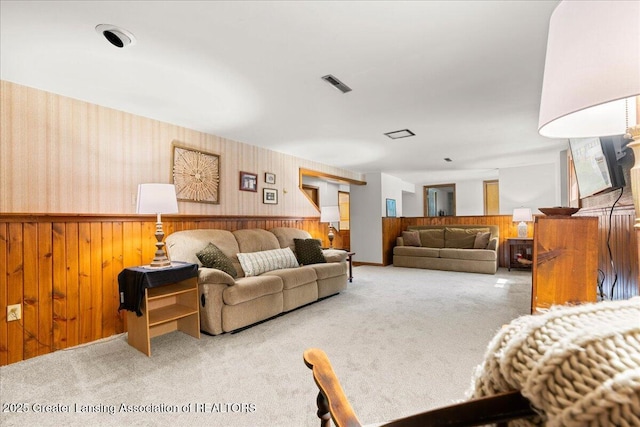 1754 S College Rd, Mason, MI 48854 - living room with wainscoting, wooden walls, and carpet