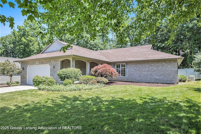 5800 Bent Tree Dr, East Lansing, MI 48823 - ranch-style house with an attached garage, brick siding, driveway, and a shingled roof