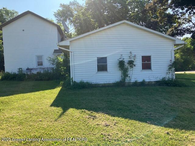 4405 Otto Rd, Charlotte, MI 48813 - view of property exterior featuring a yard