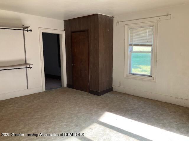 4405 Otto Rd, Charlotte, MI 48813 - unfurnished bedroom featuring carpet flooring