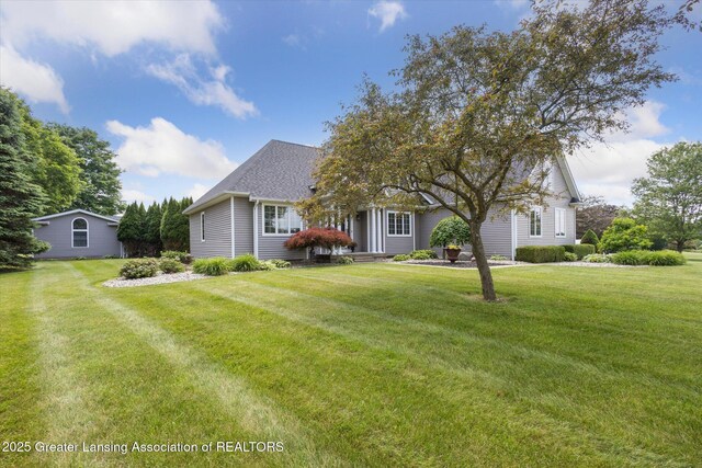 169 Mapleview Dr, Charlotte, MI 48813 - view of front of house with a front yard and roof with shingles