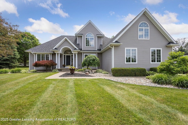 169 Mapleview Dr, Charlotte, MI 48813 - traditional-style home with a front yard and roof with shingles