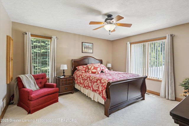 169 Mapleview Dr, Charlotte, MI 48813 - bedroom featuring light colored carpet, a textured ceiling, and ceiling fan