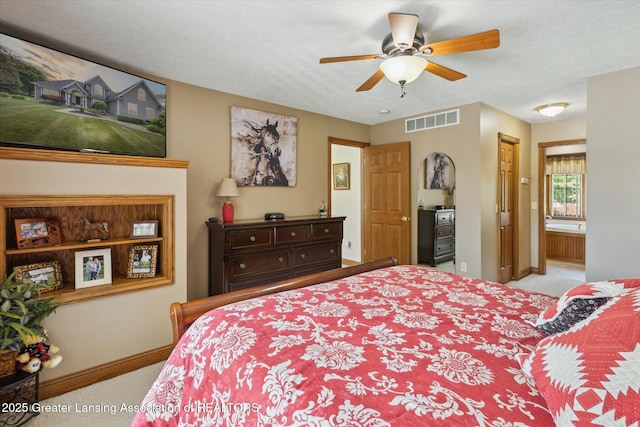 169 Mapleview Dr, Charlotte, MI 48813 - carpeted bedroom featuring connected bathroom and ceiling fan