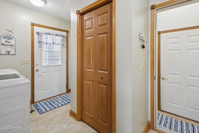 169 Mapleview Dr, Charlotte, MI 48813 - washroom featuring washer / clothes dryer and baseboards