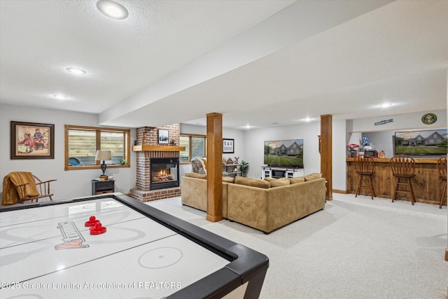 169 Mapleview Dr, Charlotte, MI 48813 - rec room with a brick fireplace, a dry bar, carpet floors, and recessed lighting
