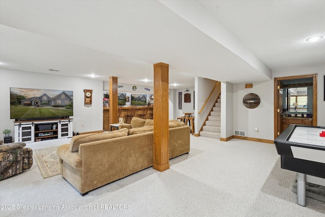 169 Mapleview Dr, Charlotte, MI 48813 - carpeted living area with stairs and recessed lighting