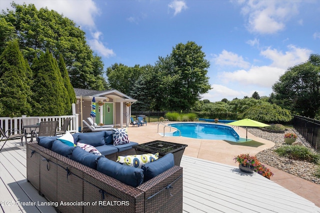 169 Mapleview Dr, Charlotte, MI 48813 - view of swimming pool with a deck, outdoor lounge area, a patio, and view of scattered trees