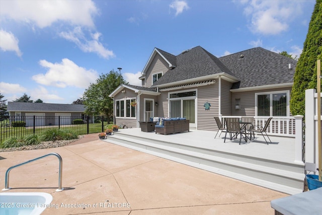 169 Mapleview Dr, Charlotte, MI 48813 - rear view of house featuring outdoor lounge area, outdoor dining space, a shingled roof, a deck, and a patio