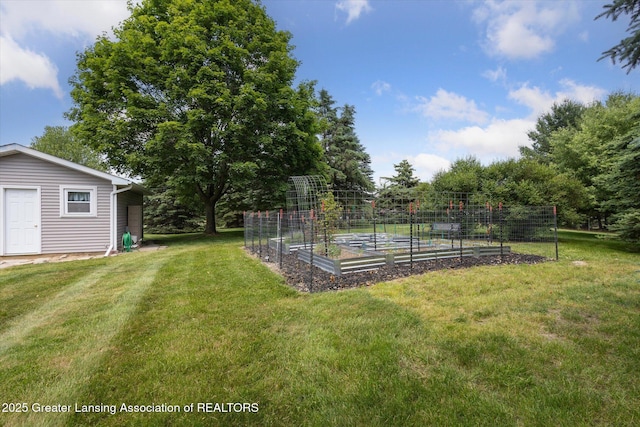 169 Mapleview Dr, Charlotte, MI 48813 - view of green lawn with a vegetable garden