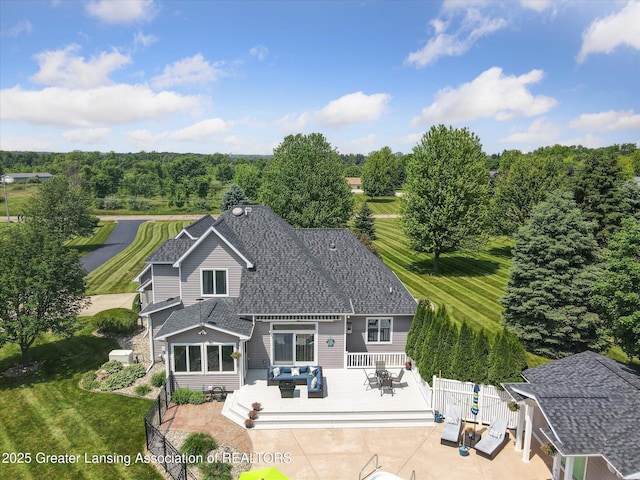 169 Mapleview Dr, Charlotte, MI 48813 - rear view of house with a deck, outdoor dining space, an outdoor hangout area, and a shingled roof