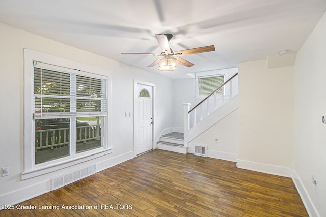 416 E Elm St, Mason, MI 48854 - foyer entrance with stairway, hardwood / wood-style flooring, a ceiling fan, and healthy amount of natural light