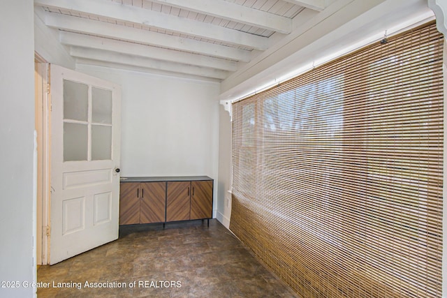 416 E Elm St, Mason, MI 48854 - hall with stone finish flooring and a wooden ceiling with exposed beams