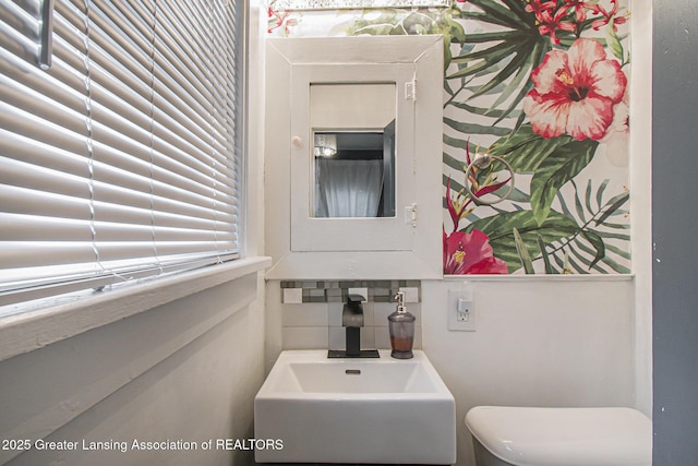 416 E Elm St, Mason, MI 48854 - bathroom with tasteful backsplash and toilet