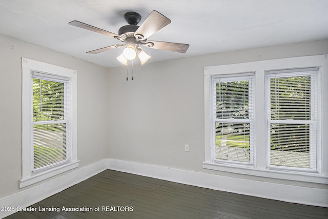 416 E Elm St, Mason, MI 48854 - spare room with dark wood finished floors and a ceiling fan