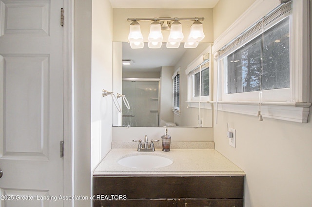 416 E Elm St, Mason, MI 48854 - bathroom featuring vanity and a shower stall