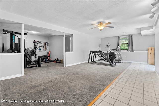 1313 W Alward Rd, Dewitt, MI 48820 - exercise area featuring carpet flooring, a textured ceiling, a ceiling fan, and tile patterned flooring
