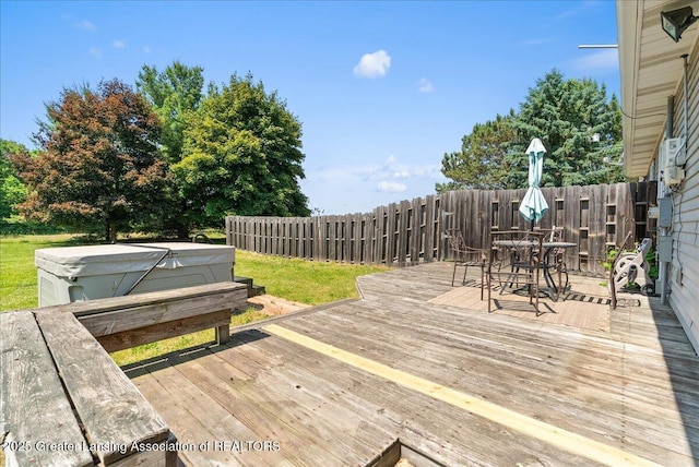 1313 W Alward Rd, Dewitt, MI 48820 - deck with a hot tub, outdoor dining area, and a fenced backyard