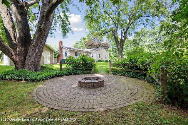 6244 Daft St, Lansing, MI 48911 - view of patio / terrace with an outdoor fire pit