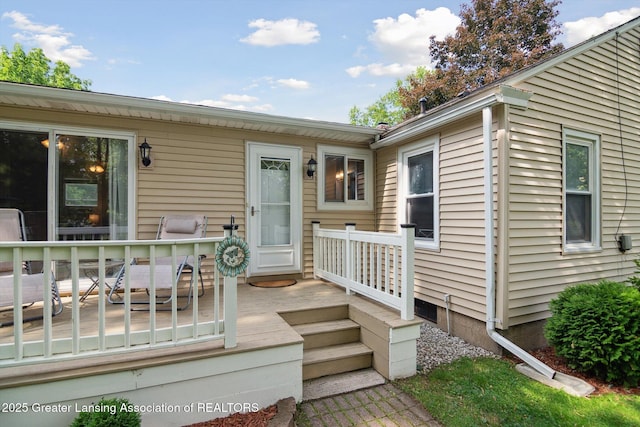 6244 Daft St, Lansing, MI 48911 - view of exterior entry with a wooden deck