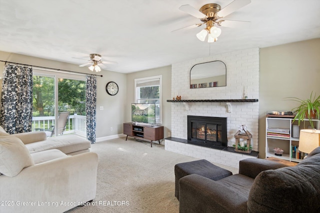 6244 Daft St, Lansing, MI 48911 - living room featuring a ceiling fan, a brick fireplace, plenty of natural light, and carpet floors