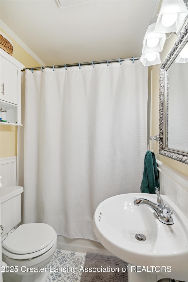 6244 Daft St, Lansing, MI 48911 - bathroom with tile patterned flooring, ornamental molding, and curtained shower
