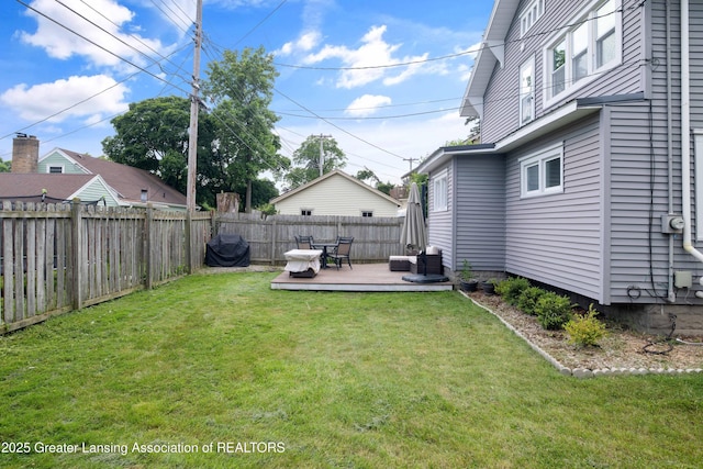 308 Memphis St, Lansing, MI 48915 - fenced backyard with a wooden deck