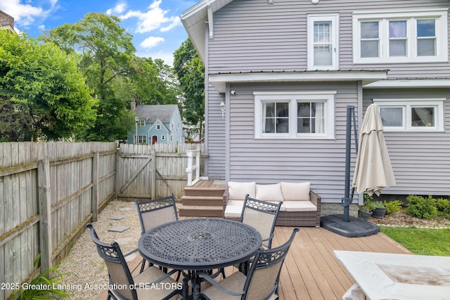 308 Memphis St, Lansing, MI 48915 - wooden terrace with a fenced backyard, outdoor lounge area, and outdoor dining space