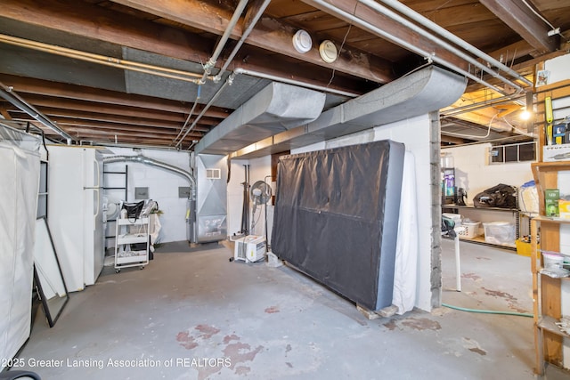 308 Memphis St, Lansing, MI 48915 - unfinished below grade area with heating unit and concrete block wall