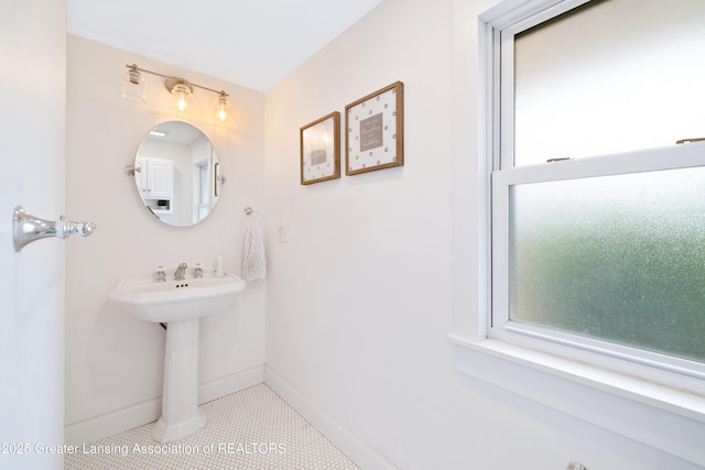 308 Memphis St, Lansing, MI 48915 - bathroom with baseboards and tile patterned flooring