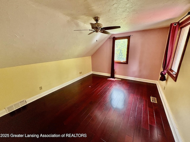 12830 Upton Rd, Bath, MI 48808 - bonus room with ceiling fan, a textured ceiling, vaulted ceiling, and hardwood / wood-style flooring