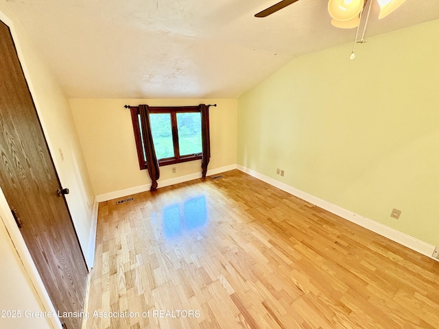 12830 Upton Rd, Bath, MI 48808 - unfurnished room featuring ceiling fan, light wood-style floors, and lofted ceiling