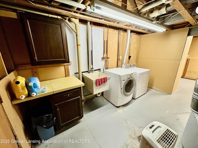 12830 Upton Rd, Bath, MI 48808 - laundry room featuring washing machine and clothes dryer and cabinet space