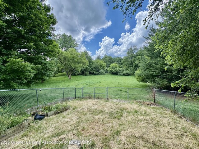 12830 Upton Rd, Bath, MI 48808 - view of yard with a vegetable garden and a view of countryside