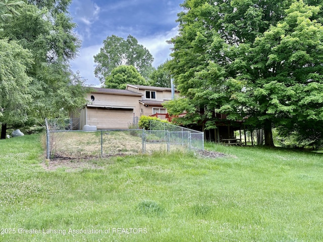 12830 Upton Rd, Bath, MI 48808 - view of yard with a garage