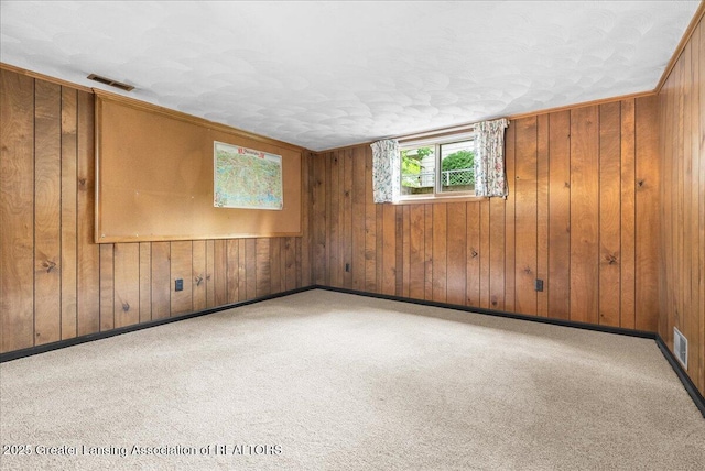 10648 Bobsyl Ln, Grand Ledge, MI 48837 - spare room with wood walls and carpet flooring