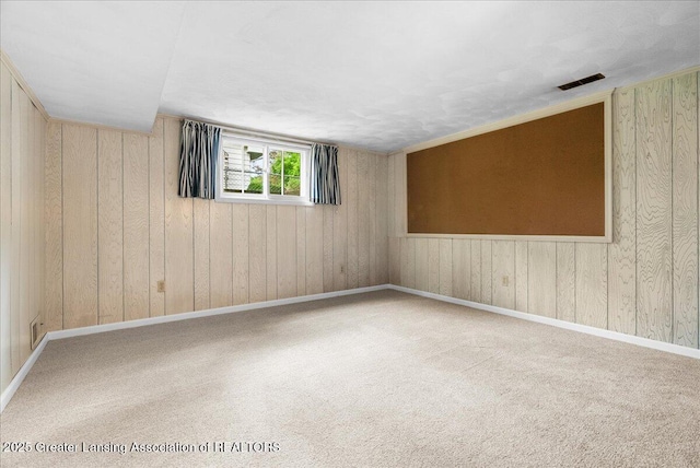 10648 Bobsyl Ln, Grand Ledge, MI 48837 - empty room featuring carpet floors and wooden walls