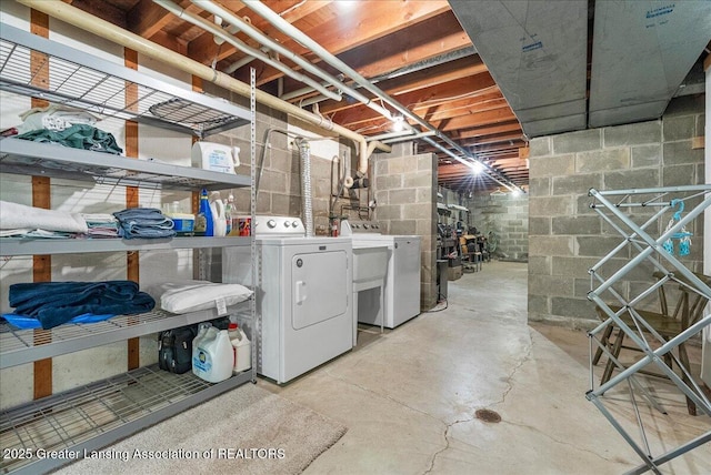 10648 Bobsyl Ln, Grand Ledge, MI 48837 - unfinished basement featuring washer and clothes dryer and concrete block wall
