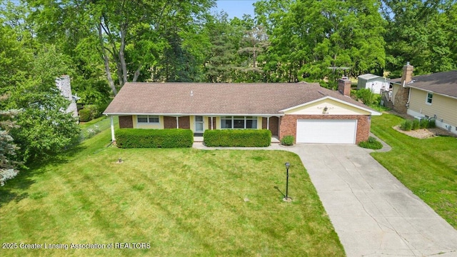 10648 Bobsyl Ln, Grand Ledge, MI 48837 - single story home with a garage, concrete driveway, brick siding, and a front yard