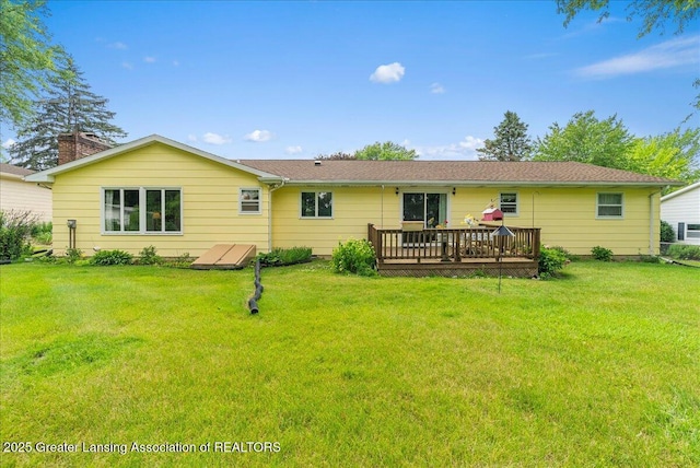 10648 Bobsyl Ln, Grand Ledge, MI 48837 - back of house featuring a wooden deck and a yard