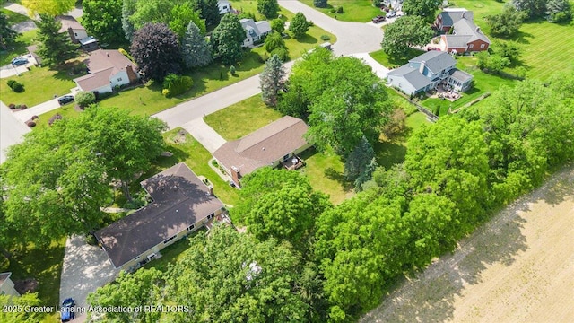 10648 Bobsyl Ln, Grand Ledge, MI 48837 - aerial view of property's location with nearby suburban area and a tree filled landscape