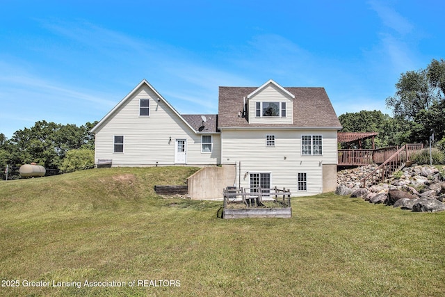 7563 6 Mile Rd, East Leroy, MI 49051 - back of house featuring a wooden deck and a lawn