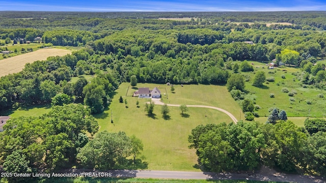 7563 6 Mile Rd, East Leroy, MI 49051 - view of property location with a heavily wooded area