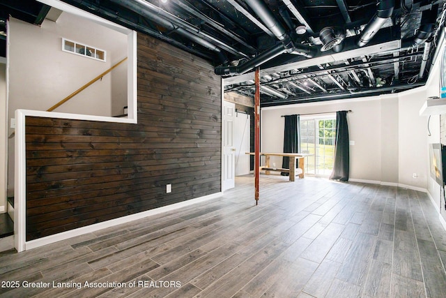 7563 6 Mile Rd, East Leroy, MI 49051 - basement with wood finished floors and a fireplace