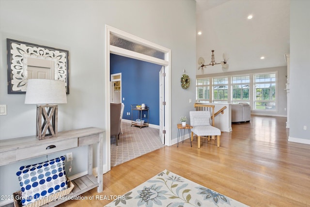 5056 W Bunker Rd, Mason, MI 48854 - living area with wood finished floors, recessed lighting, and a towering ceiling