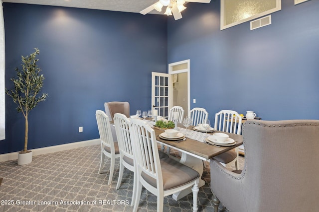 5056 W Bunker Rd, Mason, MI 48854 - dining room with ceiling fan and a high ceiling